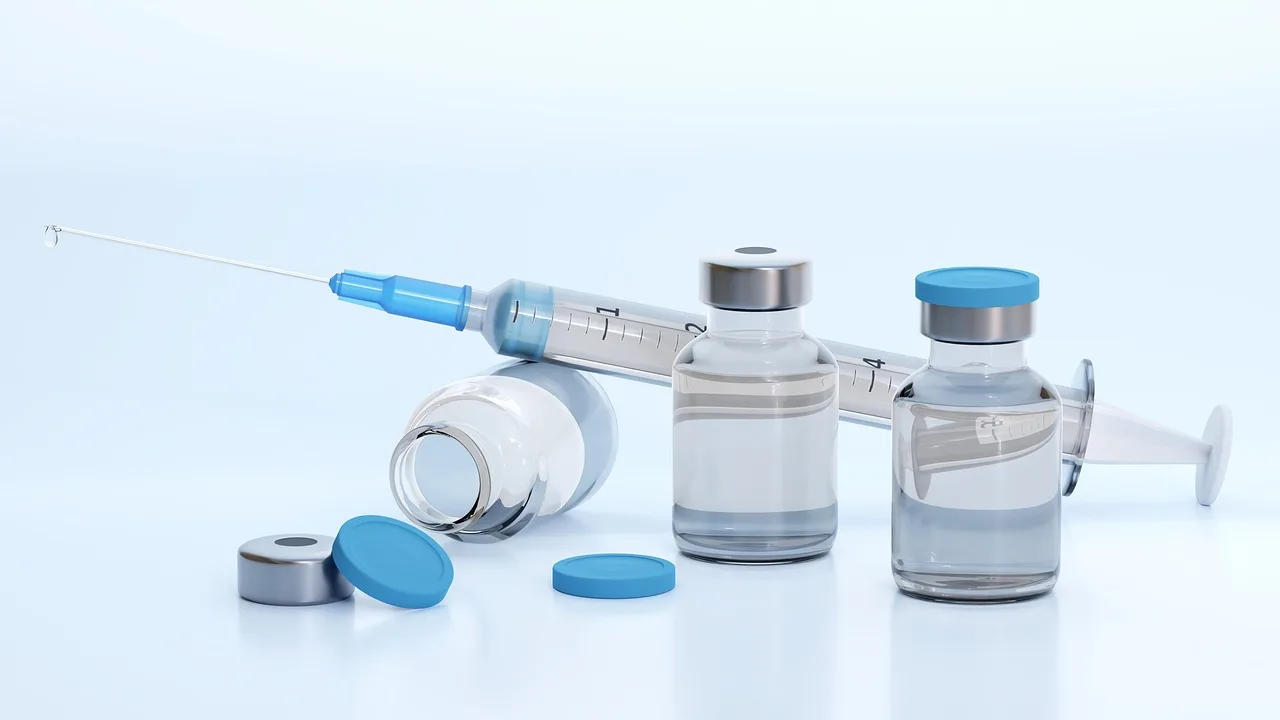Clinician preparing a vaccine syringe